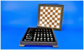 Dragons and Demons Chess Set, enclosed within the chess board.