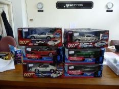 A Collection of 6 James Bond Model Cars. 5 mint in unopened boxes, 1 opened. Including 1965 Aston
