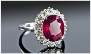 14ct White Gold Ruby & Diamond Ring, Set With An Oval Cut Ruby (Estimated Weight 6.50ct) Surrounded