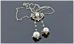 18ct White Gold Diamond And Natural Pearl Pendant Of Floral Open Work Design Set With A Central