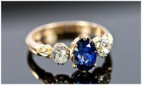 18ct Gold Sapphire And Diamond Ring, Central Deep Blue Oval Cut Sapphire Set Between Two Old Cut
