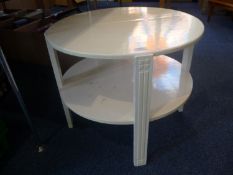 Small Circular Two Tier Coffee Table, painted white 20 inches high, 24 in diameter.