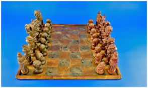 African Soapstone Chessboard and Matching Pieces. Early to Mid Twentieth Century. (Bought from