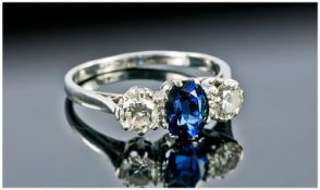 Very Fine 18 Carat White Gold 3 Stone Sapphire and Diamond Ring, the faceted sapphire of excellent