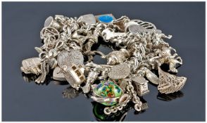 Silver Charm Bracelet, Loaded With 40+ Charms, Complete With Padlock Fastener And Safety Chain.