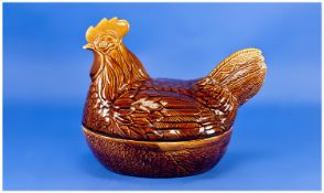 Price Kensington Egg Tureen, in the form of a hen, with a treacle coloured textured body, the top