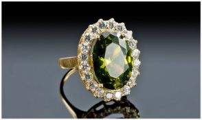 18ct Gold Cluster Ring, Set With A Large Green Faceted Stone Surrounded By White Faceted Stones,