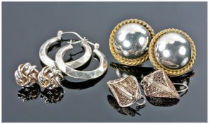 Four Pairs Of Silver Earrings.