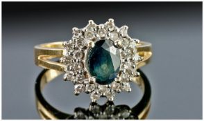 18ct Gold Diamond & Sapphire Cluster Ring, Set With A Dark Blue/Green Sapphire Surrounded By Round