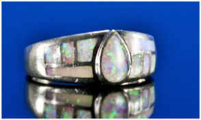 Silver Dress Ring Inlaid With Opal Coloured Stones.