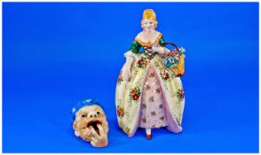 A Hand Painted Mid 20th Century Ceramic Figure Of A Young Woman, in 19th century French dress