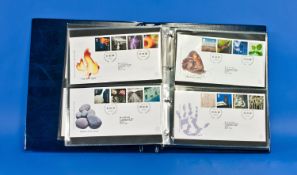 Blue Royal Mail Millenium Collection Of First Day Covers Album in slipcase, containing 13 1st day