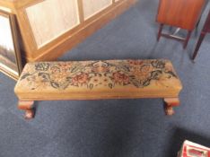 Oblong Tapestry Stool, embroidered with floral decoration on cabriole ball and claw feet.