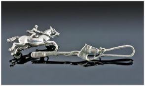 Two Silver Equestrian Brooches.