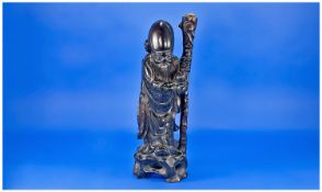 Small Chinese Carved Cherrywood Figure of a sage holding a wooden staff, 14 inches high, circa