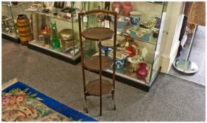 Oak Folding Cake Stand, of three tier form, 34 inches high.