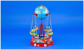 West German Tin Toy Fairground Ride with World globe above  a carousel base, marked Made in West