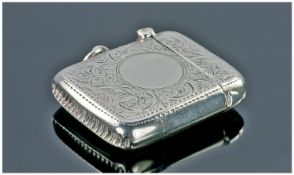 Chester Silver. A Cushion Shaped Edwardian Vesta Case with floral decoration to the exterior, ring