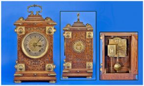 Winterhalder & Hofmeier. Fine and Impressive Carved Oak Cased Bracket Clock with gilt brass mounts.