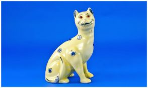 Galle Style Small Yellow Glazed Cat with glass eyes, decorated in underglaze blue with hearts,