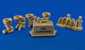 Collection of Lurpak Ceramics comprising butter dish, toast rack and four egg cups.