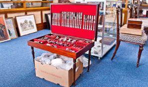 Modern 12 Place Canteen of Cutlery, in a mahogany case, measuring 19 inches high, 30½ wide and 19