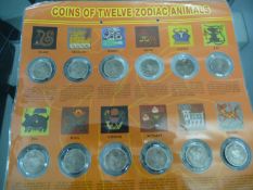 Set of 12 Oriental Style Coins each depicting one of the 12 Zodiac animals.