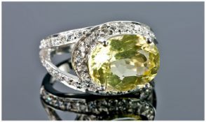 Sterling Silver Dress Ring, Set With An Oval Cut Yellow Quartz (Approx 6.00cts) Surrounded By White