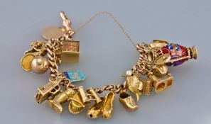 9ct charm bracelet loaded with 23 good quality gold charms. Both bracelet and charms fully