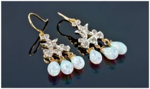 Pair Of 10ct Gold Diamond And Opal Earrings, Each Set With 12 Round Cut Diamonds And Three Opal