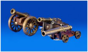 Three Brass Miniature Cannons On Wooden Carriages.