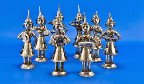 An Interesting 20th Century 8 Piece Oriental White Metal Figure Band. All Figures Playing Various