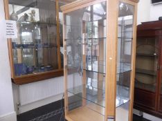 Modern Bleached Sycamore Wood Contemporary Glazed Display Cabinet, on decorative metal legs. 81