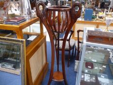 Modern Mahogany Tall Plant Stand, with eagle headed terminals to top, raised on a tripod stand, 51