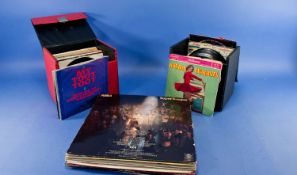 Two Boxes of 45 rpm Records to include Elvis Presley, Roy Orbison, Ghostbusters and 14 LP`s