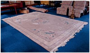 Large Chinese Room Sized Woolen Rug, with a dragon design pattern on a cream ground, measuring