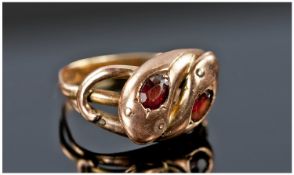 Victorian Rose Gold Snake Ring Set With Large Ruby Eyes. Not marked but tests as gold. 4.3 grams.
