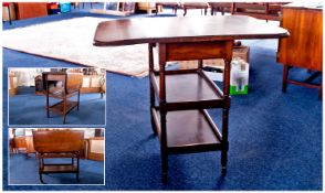 Mid 20th Century Oak Drinks Trolley, of three tier form, with folding leaves to sides, 30 inches