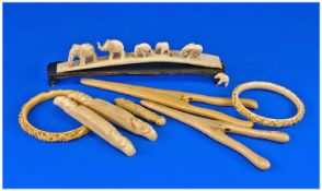 Collection Of Ivory, Comprising Bangles, Glove Stretchers, Knife Rests, Bridge With Six Elephants