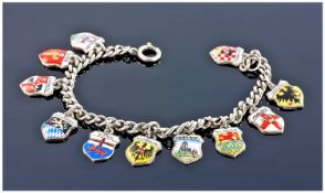 A Silver Bracelet Loaded With 11 Silver And Enamel European Town Crests. Stamped 800. 23 grams.