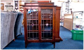 Early 20th Century Oak Display Cabinet, fitted with two leaded doors, opening to reveal fitted