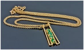 High Carat Gold Modernist Pendant Set With A Row Of Four Rough Cut Emeralds In A Wire Work 1970`s