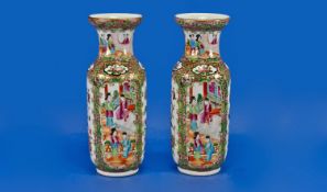 A Pair Of Chinese Cantonese Vases Of Small Size, decorated in the famille rose pallet, with