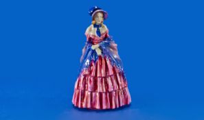 Royal Doulton Figure `A Victorian Lady`, HN 728, depicting a lady wearing a red crinoline dress and
