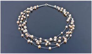 Multistrand Cultured Freshwater `Floating Pearl` Necklace, six strands of peach, pale lilac and