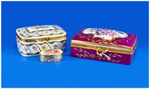 Two Various Limoges Trinket Boxes and a pill box similar, the trinket boxes with metal framed rims