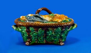 Majolica Style Game Pie Dish, the dish in the form of brown woven wicker, overlaid with green