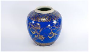 A Kangxi Chinese Ginger Jar with a powder blue body painted with gilt decoration depicting peaches