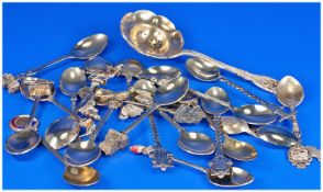 Twenty Three Silver Plated Souvenir Spoons, some enameled, some with cast top emblems of towns in