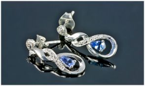 Tanzanite Infinity Setting Earrings, single pear cut tanzanites, named by Tiffany, New York in the